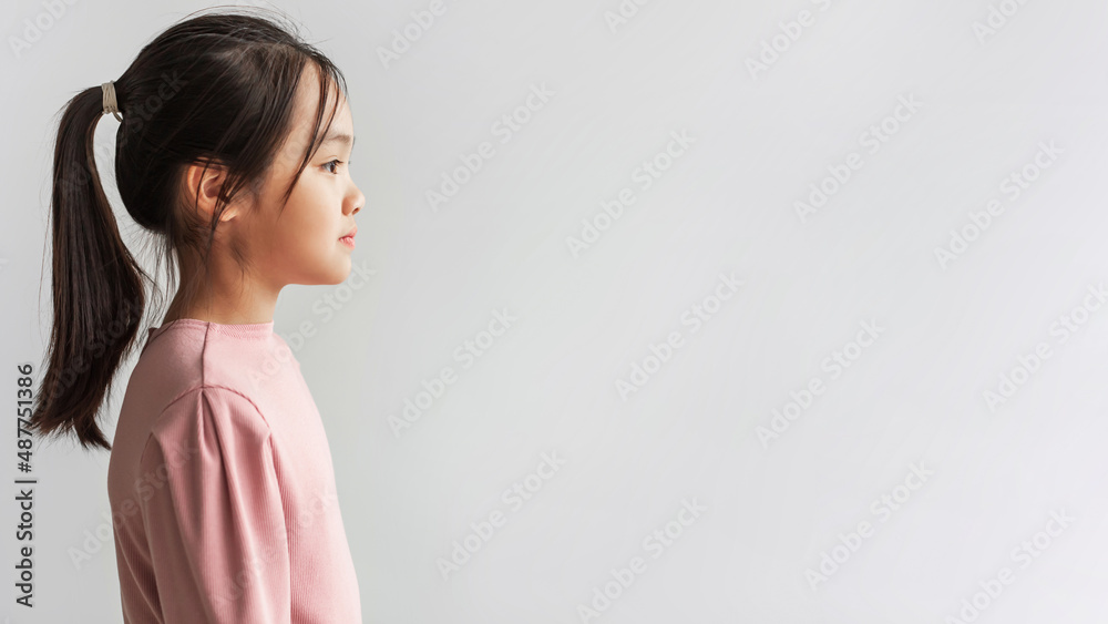 Profile Portrait Of Serious Asian Girl Looking Aside, Gray Background Profile Portrait Of Serious Asian Girl Looking Aside, Gray Background