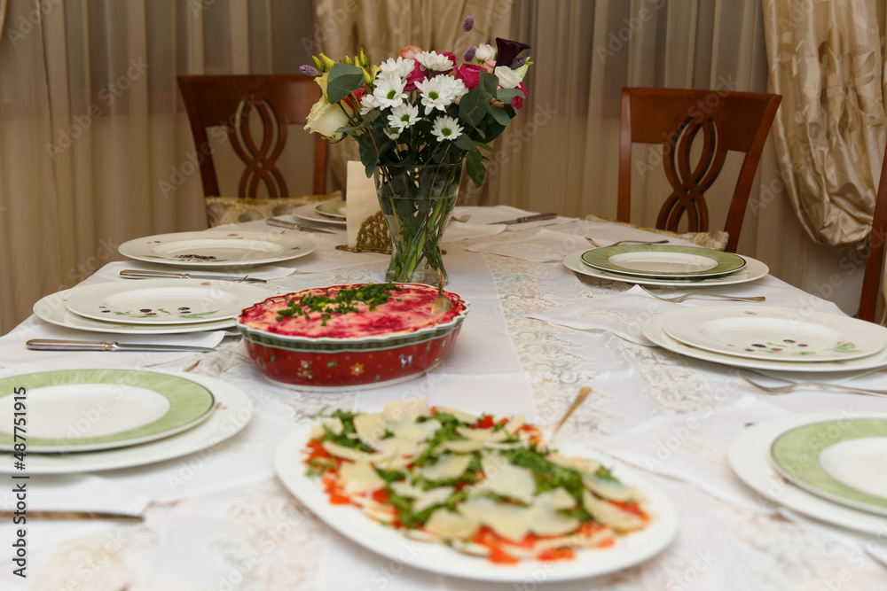 Table setting with dishes and tableware in stylish home interior. Table setting with dishes and tableware in stylish home interior.