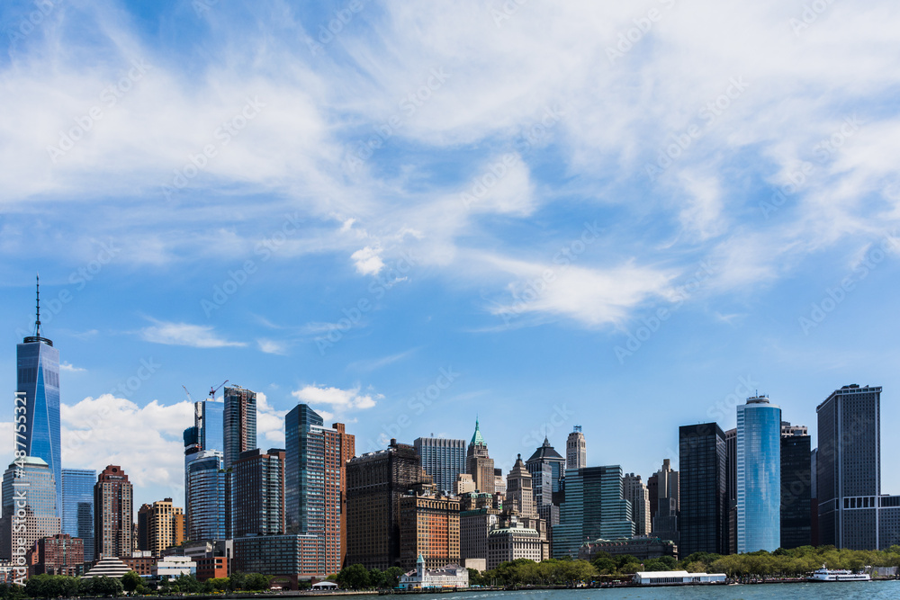 Fototapeta premium New York,NY USA august 09 2016 panoramic photo of new york in color with sailboat Manhattan