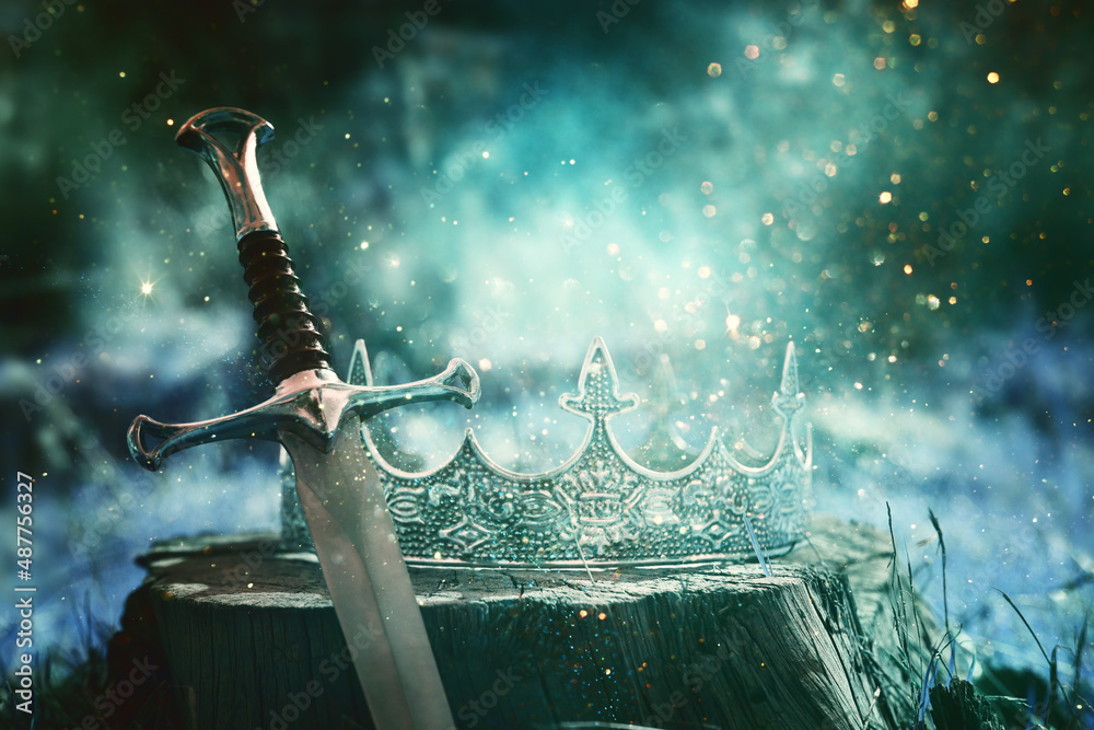 mysterious and magical photo of gold king crown and sword in the