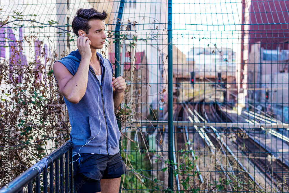 Fototapeta premium Male runner man taking a break from running training.