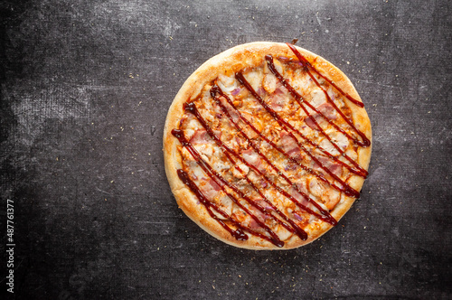 Pizza on a gray dark background top view