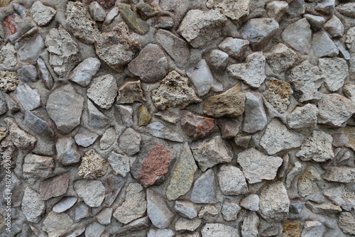 Close view of wall with gravel pebble dash in shades of gray photo