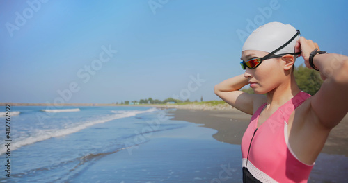 woman training triathlon at beach