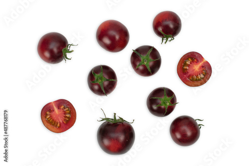 Three 3 black tomatoes cultivars isolated on white background. Various shapes of tomatoes. photo