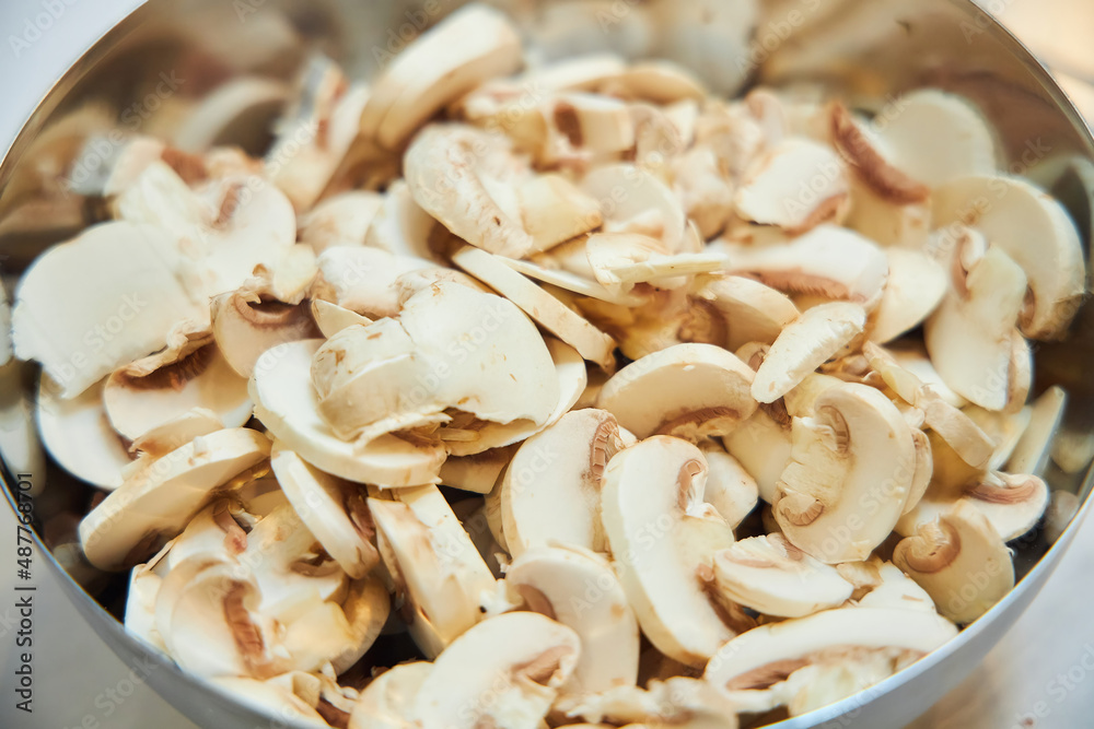Chopped mushrooms in a plate. Ingredients for cooking the dish. Chopped mushrooms in a plate. Ingredients for cooking the dish.