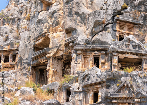 Rock-cut Lycian tombs in Myra. Ancient necropilis. Close up view. Open air museum in Demre (Turkey). Famouse tourist attraction, very pupular tour. Travel of history concept