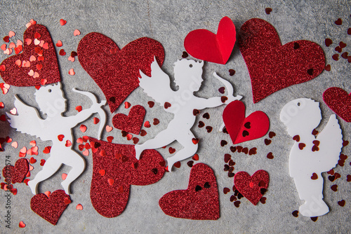 Little red hearts and white amour on light background for Happy Valentine's Love pattern