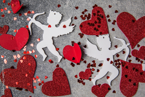 Little red hearts and white amour on light background for Happy Valentine's Love pattern