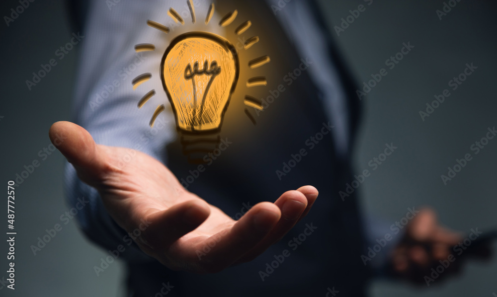 man holding and using a digital device and bulb hologram man holding and using a digital device and bulb hologram