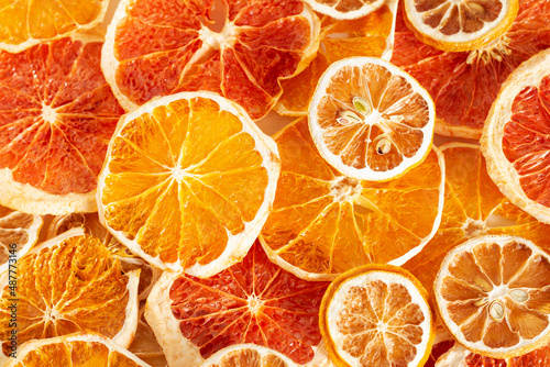 Texture of citrus. Dried slices of oranges  lemons  grapefruits. Bright background.