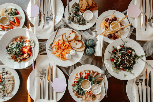 Served table in a restaurant with various snacks close-up