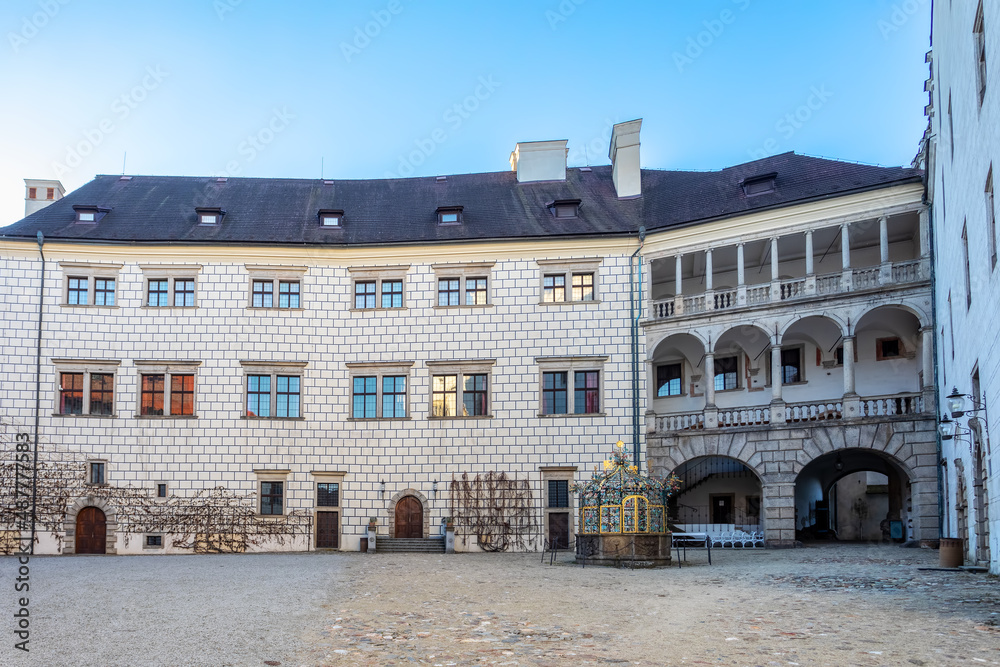 The historical castle complex in old town of Jindrichuv Hradec city. View of courtyard with a fountain. It is the third largest castle complex in the Czech Republic