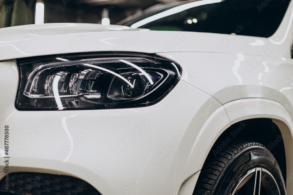 Close up white car head lights Close up white car head lights