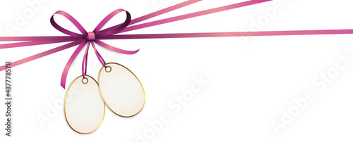 Fotografia pink colored ribbon bow with hang tag
