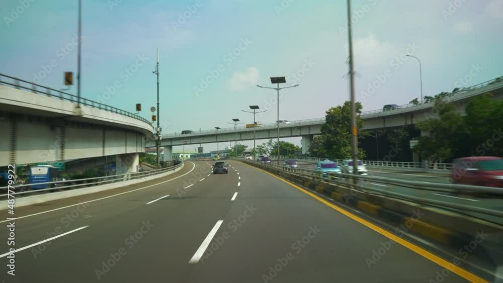 day time jakarta city urban traffic street taxi road trip to airport front pov panorama 4k indonesia day time jakarta city urban traffic street taxi road trip to airport front pov panorama 4k indonesia