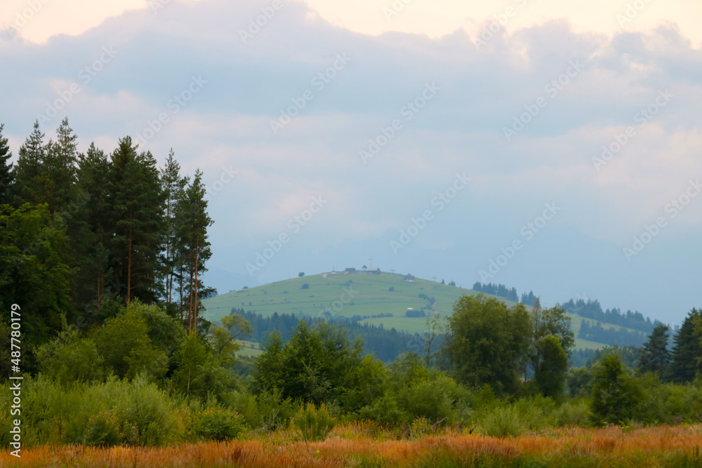 A picturesque view of the mountains on a foggy autumn morning. A picturesque view of the mountains on a foggy autumn morning.