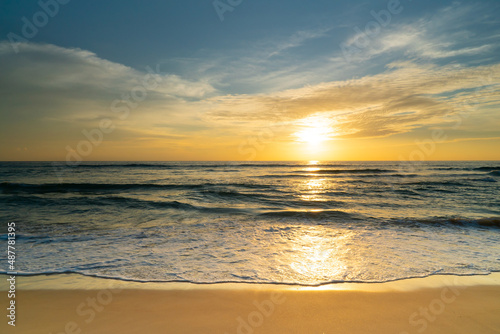 Beautiful beach sunset Water wave on sandy beach