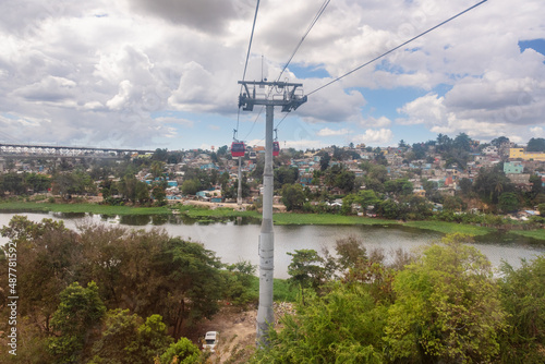 View of the poorest neighborhoods of Santo Domingo on the banks of Ozama river from teleferico cable car, slum and poverty of the capital city of Dominican Republic, Caribbean photo
