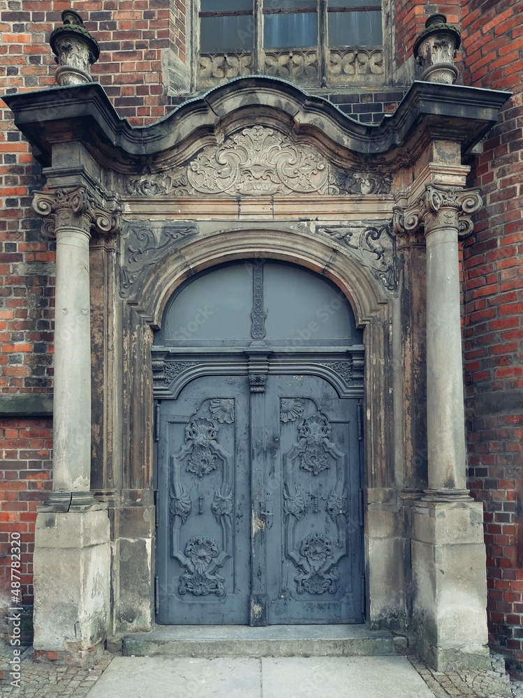Old door between two columns