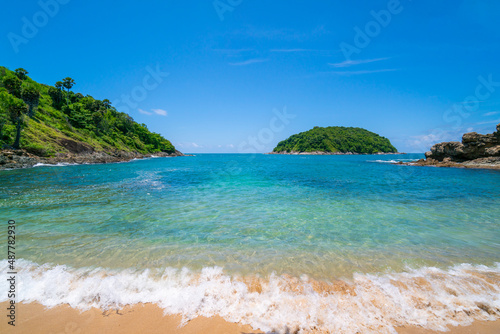 Summer beach sea with island in summer sun blue sky background.