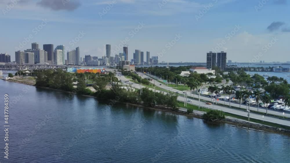 Aerial view establishing shot of Causeway in front Miami skyline video background | Modern architecture buildings of Miami city in background causeway video background in 4K Aerial view establishing shot of Causeway in front Miami skyline video background | Modern architecture buildings of Miami city in background causeway video background in 4K