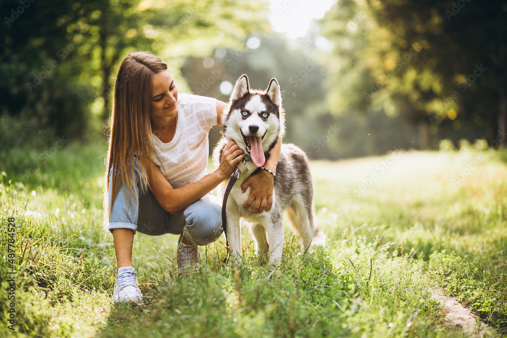 Girl with her dog in park Girl with her dog in park