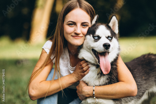 Girl with her dog in park