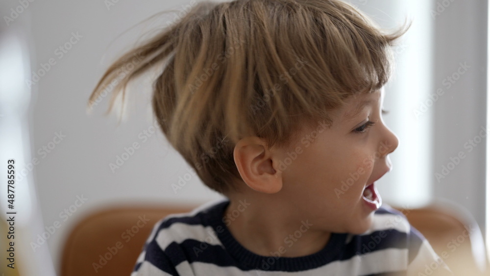 One child shakes head and hair being goofy and fun One child shakes head and hair being goofy and fun