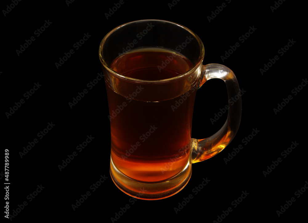 Glass cup of tea isolated on black background Glass cup of tea isolated on black background