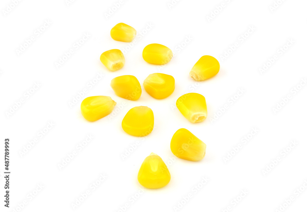 Yellow corn seeds isolated on white background Yellow corn seeds isolated on white background