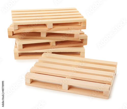 Many small wooden pallets on white background