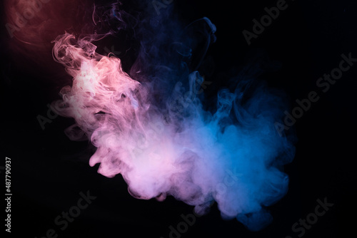Blue and pink steam on a black background. © Nikolay