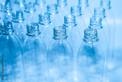 Bottling plant - Plastic bottles. Abstract background of plastic bottles. Selective focus