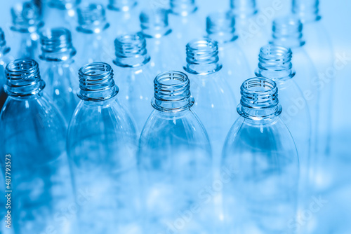 Bottling plant - Plastic bottles. Abstract background of plastic bottles. Selective focus