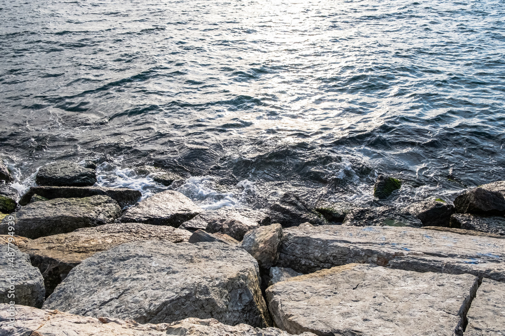 Waves washing rocks in the sea.