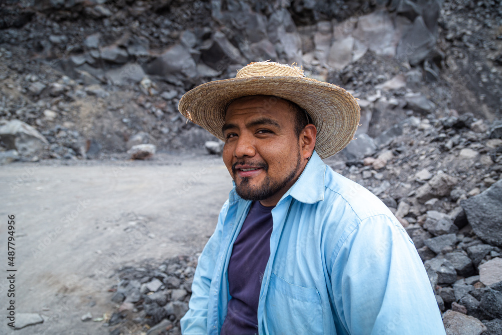 close up shot of a man in a volcanic stone quarry