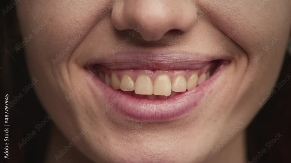 Extreme close up of a smiling caucasian young adult woman Extreme close up of a smiling caucasian young adult woman
