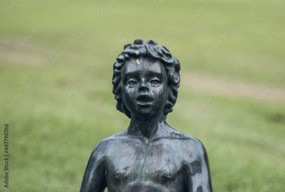 Kid sculpture in the garden