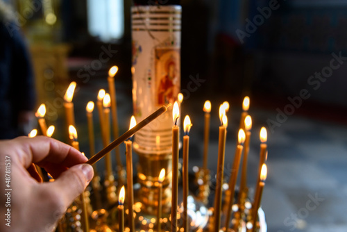 Obraz na plátně Candles in Russian orthodox cathedral with icons on background