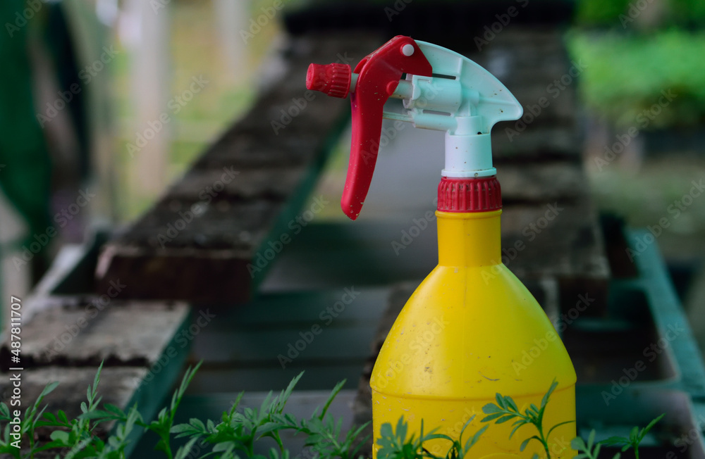 Naklejka premium sprayer in the garden