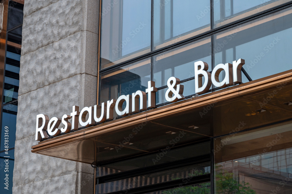 restaurant & bar sign on the street