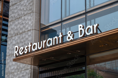 restaurant & bar sign on the street