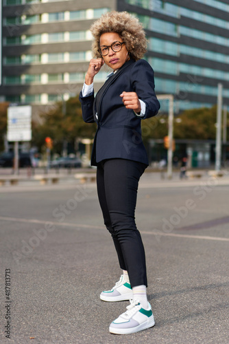 Portrait of business african american girl in fighting pose. Hard business concept