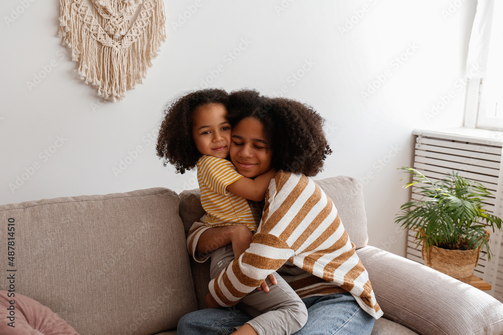 Younger And Older Sister Spending Time Together At Home Two Black