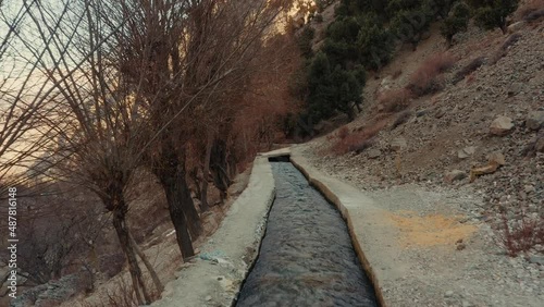 Aerial shot of a small river stream in the mountains