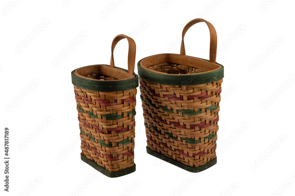 Stack of wicker straw osier handmade baskets different size and pattern