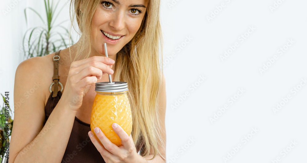Portrait of attractive smiling woman holding smoothie jar. Copy space. Summer drink concept. Portrait of attractive smiling woman holding smoothie jar. Copy space. Summer drink concept.