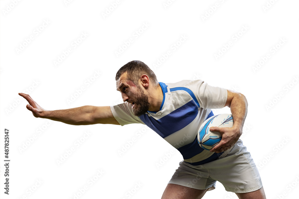 Defensive play. One male rugby players playing rugby football isolated on white background. Sport, activity, health, hobby, occupations concept Defensive play. One male rugby players playing rugby football isolated on white background. Sport, activity, health, hobby, occupations concept