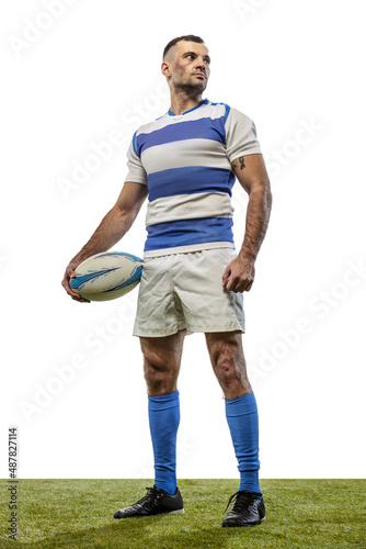 Portrait of serious man, rugby player posing with ball isolated on white background. Concept of action, motion, sport, hobby, ahievements photo